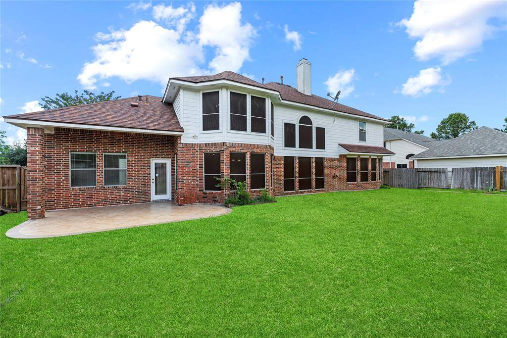 Private backyard with an extended patio area.