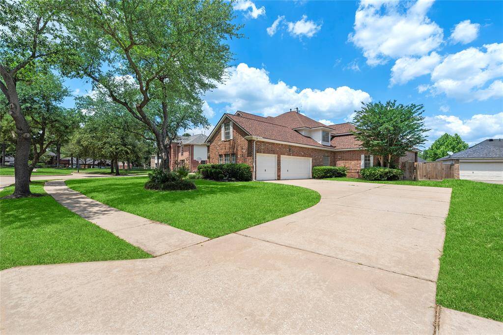 3-car attached garage and long driveway provide plenty of parking.