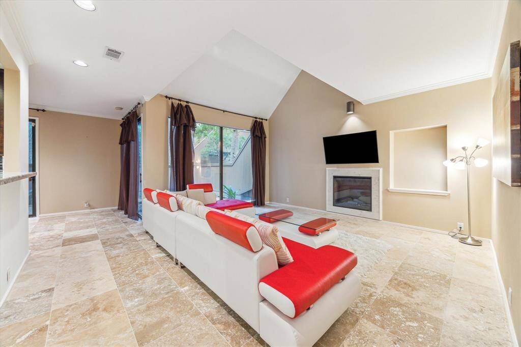 The open-concept layout seamlessly connects the living, dining, and kitchen areas.