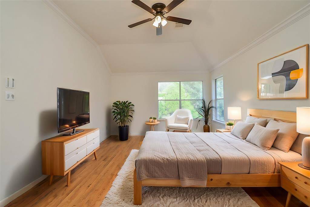 Primary bedroom has a new ceiling fan with light. This is a virtually staged primary bedroom to give you an idea of how big the room is.