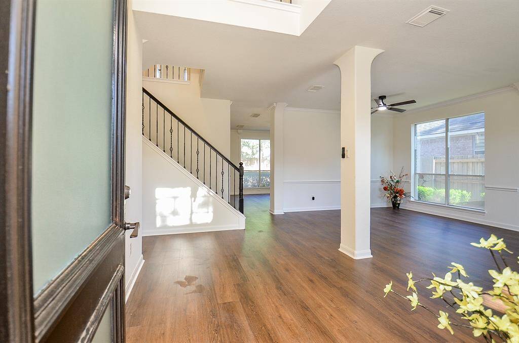 Gleaming LVP flooring greets you as you enter the foyer