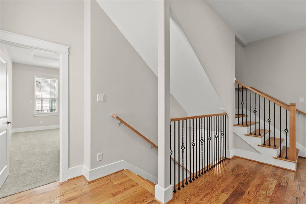2nd floor contains all the bedrooms, standing on landing looking into primary bedroom