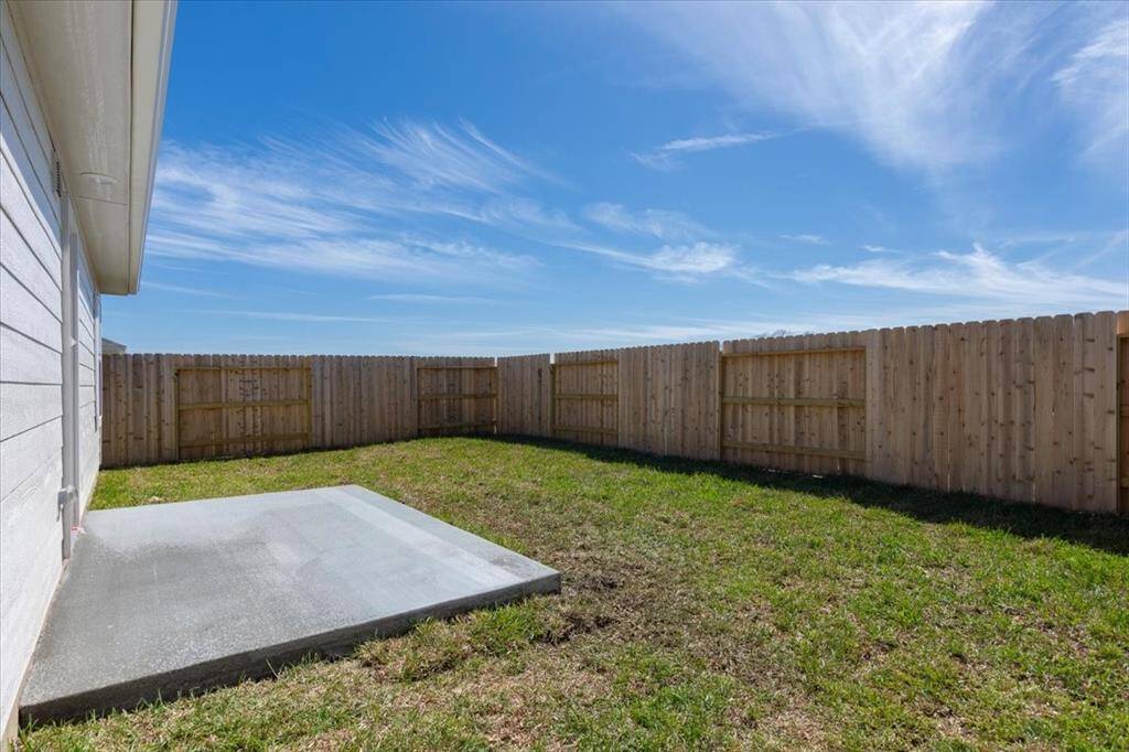 The backyard is nicely sized and low maintenance, featuring a freshly added concrete patio for tenants to relax and enjoy outdoor living.