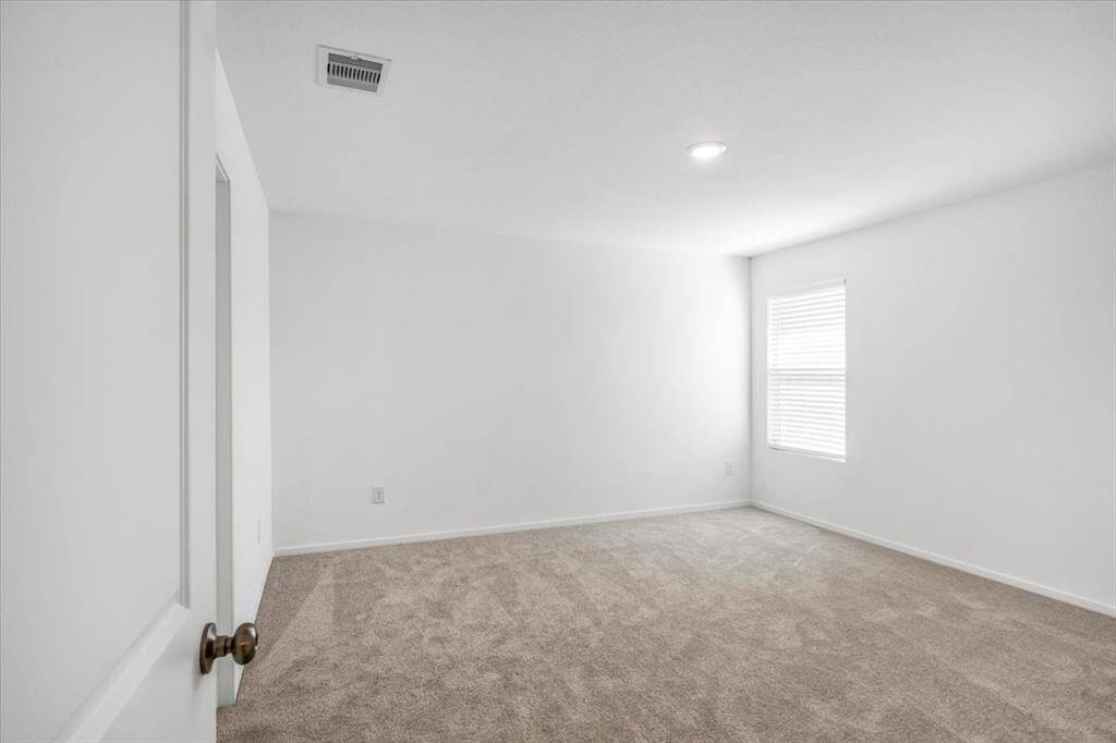 Primary suite is nicely sized and can accommodate large furniture.