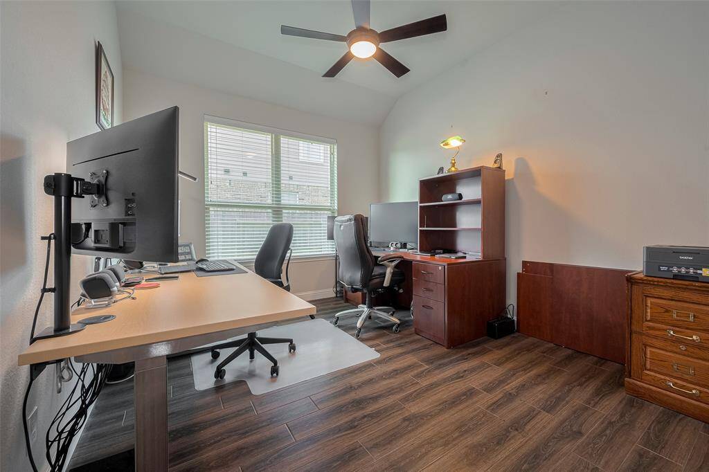 Spacious office space with wood like tiles.