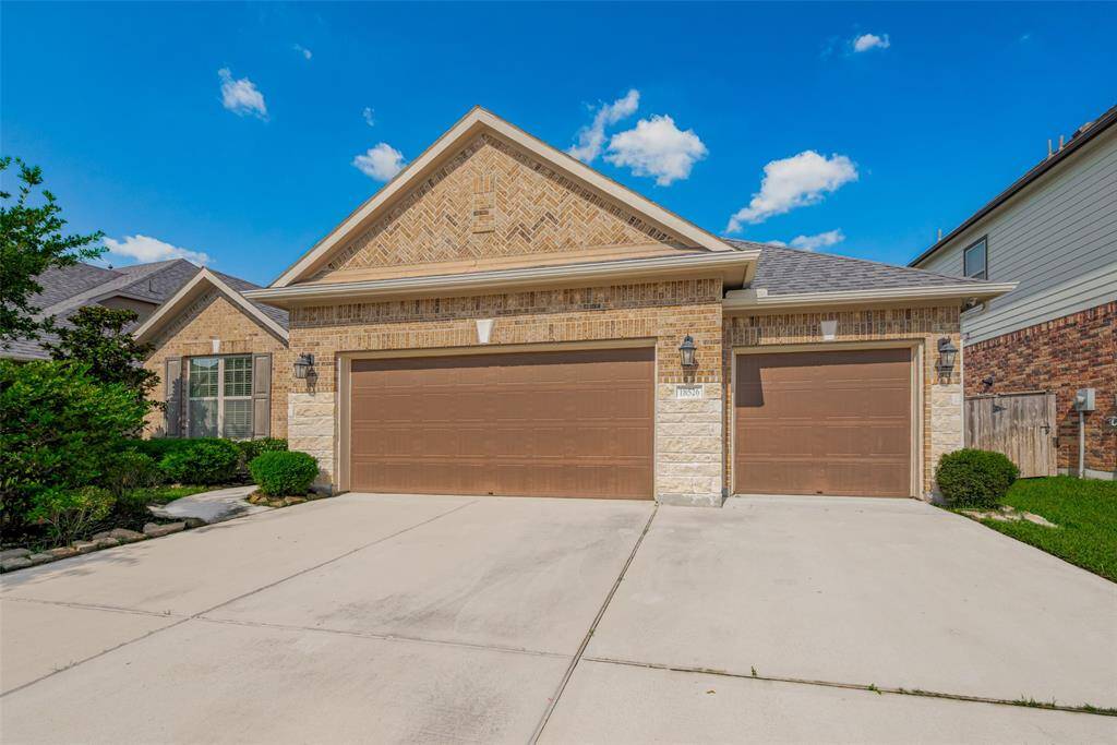 Gorgeous brick and stone exterior and a 3 car garage!