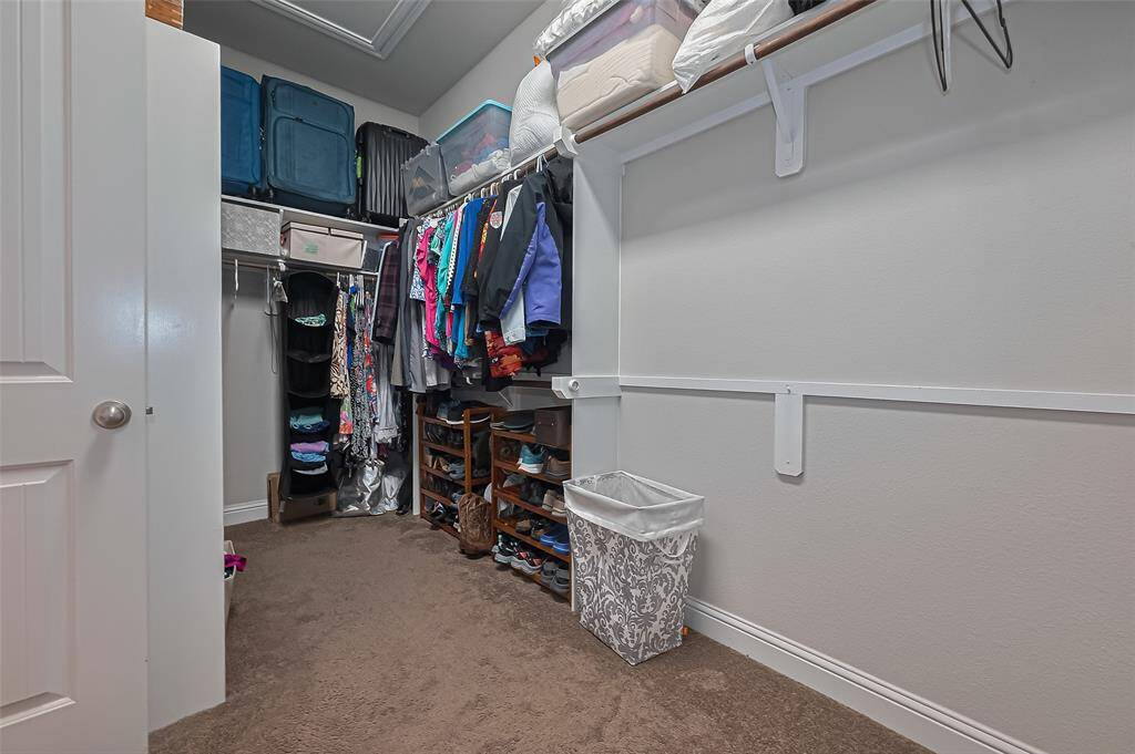 Enormous primary closet which makes a great storage area