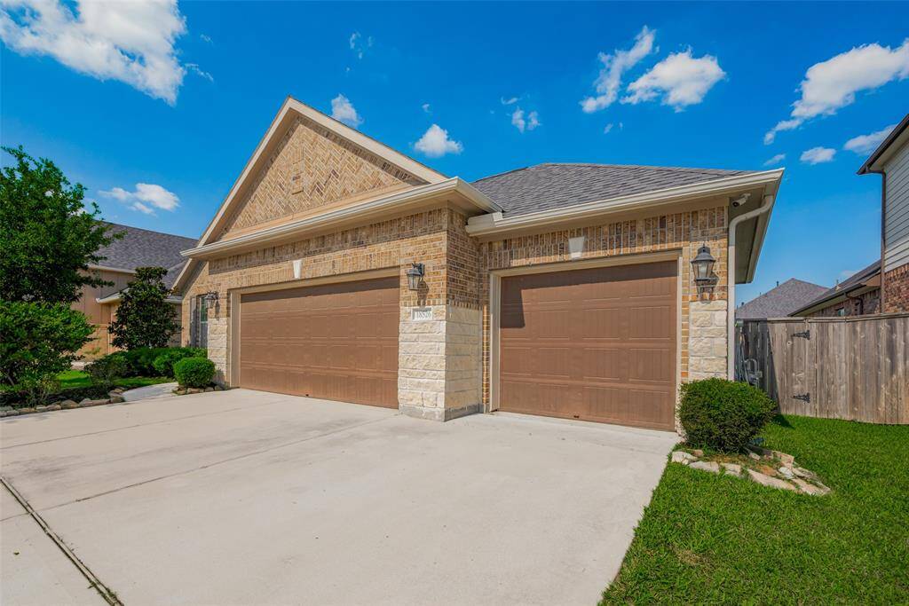 Another view of the extended driveway and 3-car garage