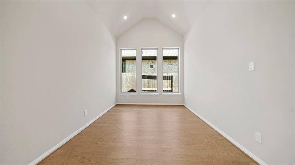 Divine Dining Room offers slanted ceilings, handsome hardwood flooring, making this an idea place to host your next gathering!