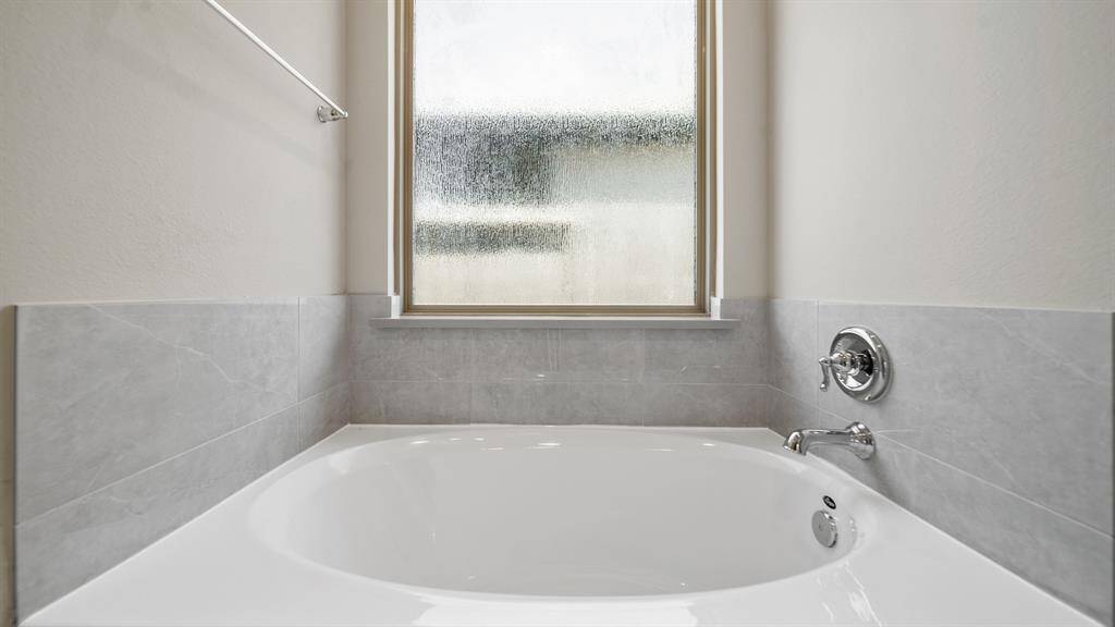 Relax the day way in this soaking tub in the Peaceful Primary Bath Oasis.