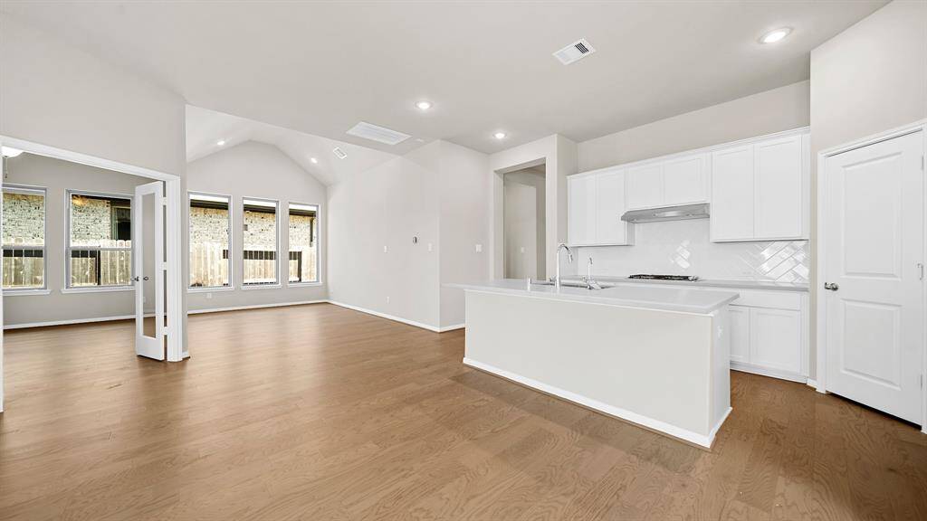The Gourmet Kitchen is open to the Luxurious Living Room and Divine Dining Room, ideal for entertaining!