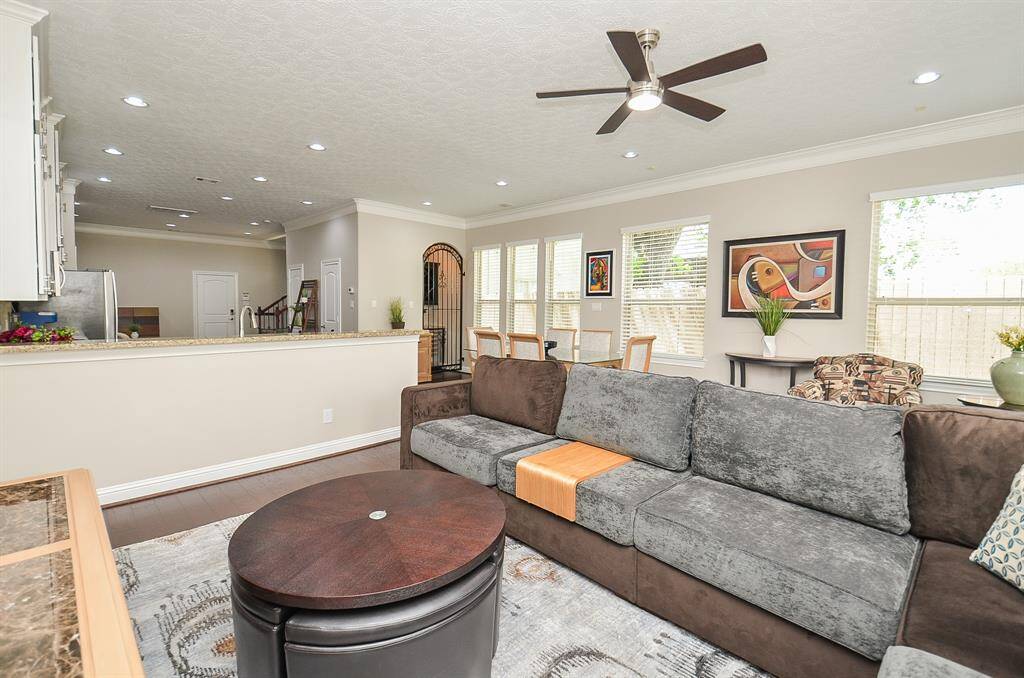 Where life flows with ease. This open-concept space brings everyone together—whether you’re cooking, lounging, or helping with homework from the couch. Fresh paint, new ceiling fans, and recessed lighting set the scene for everyday comfort and effortless hosting.