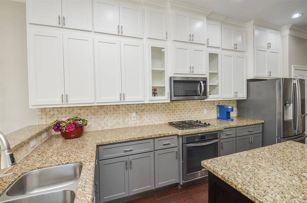 Smart, sleek, and totally custom. These upgraded wood cabinets—with decorative glass inserts—weren’t just refinished, they were added and replaced in 2023 to bring both elegance and everyday ease to the heart of the home.