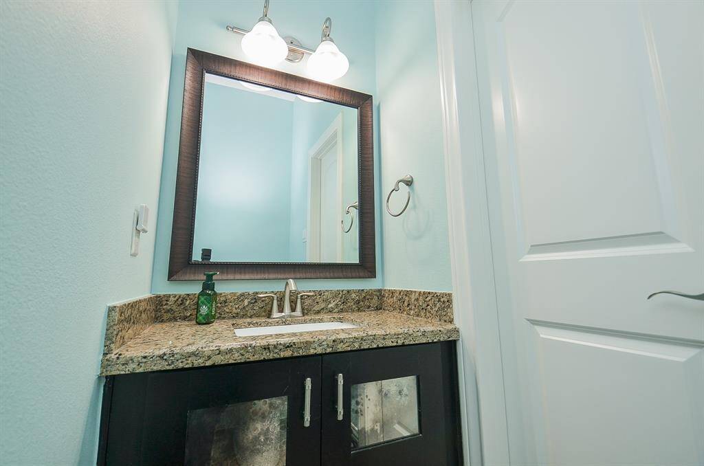 Convenient, private, and thoughtfully updated. This main-level guest powder bath means guests never have to go upstairs, and it’s been refreshed with new paint, fixtures, and accessories—all the essentials, right where you need them.