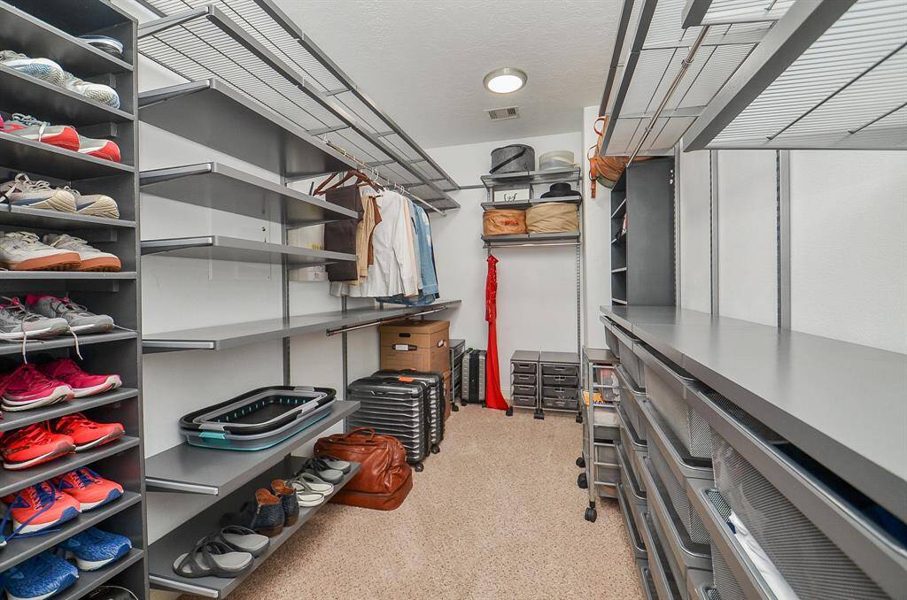 Finally, a closet that keeps up. Outfitted with a custom Elfa shelving system (2023), this spacious walk-in gives everything—from heels to hoodies—its own place. Getting dressed just got a whole lot easier.