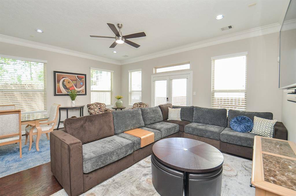 Room to relax, gather, and just be. Fresh paint and new ceiling fans add a crisp, updated feel, while sunlight pours in from every angle. It’s the perfect spot for cozy nights, lively hangs, or just soaking up the peace of home.