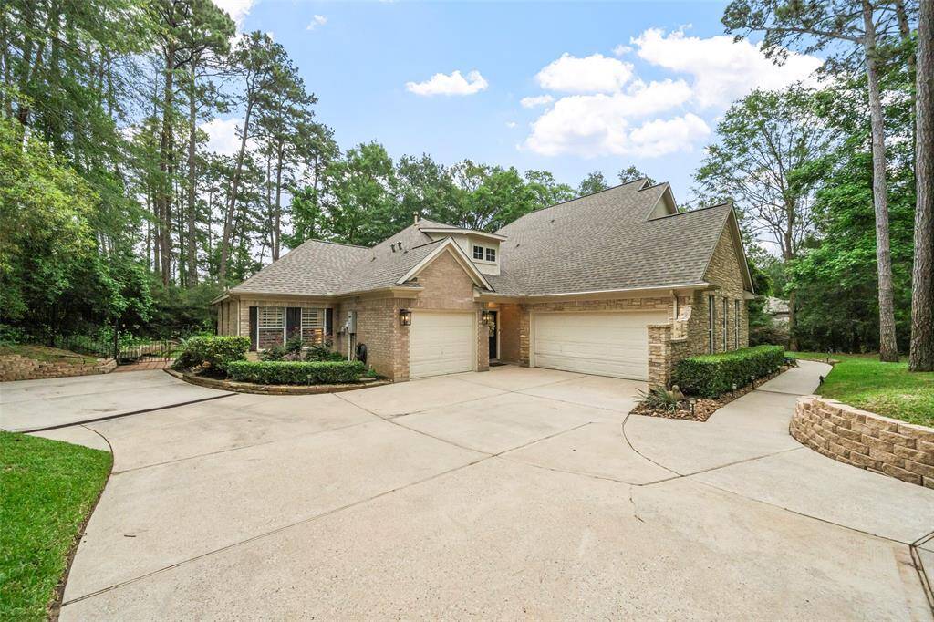Side view of home to show additional parking and the 2 car garage. NOTE - the 3rd car garage was converted to a "man cave".