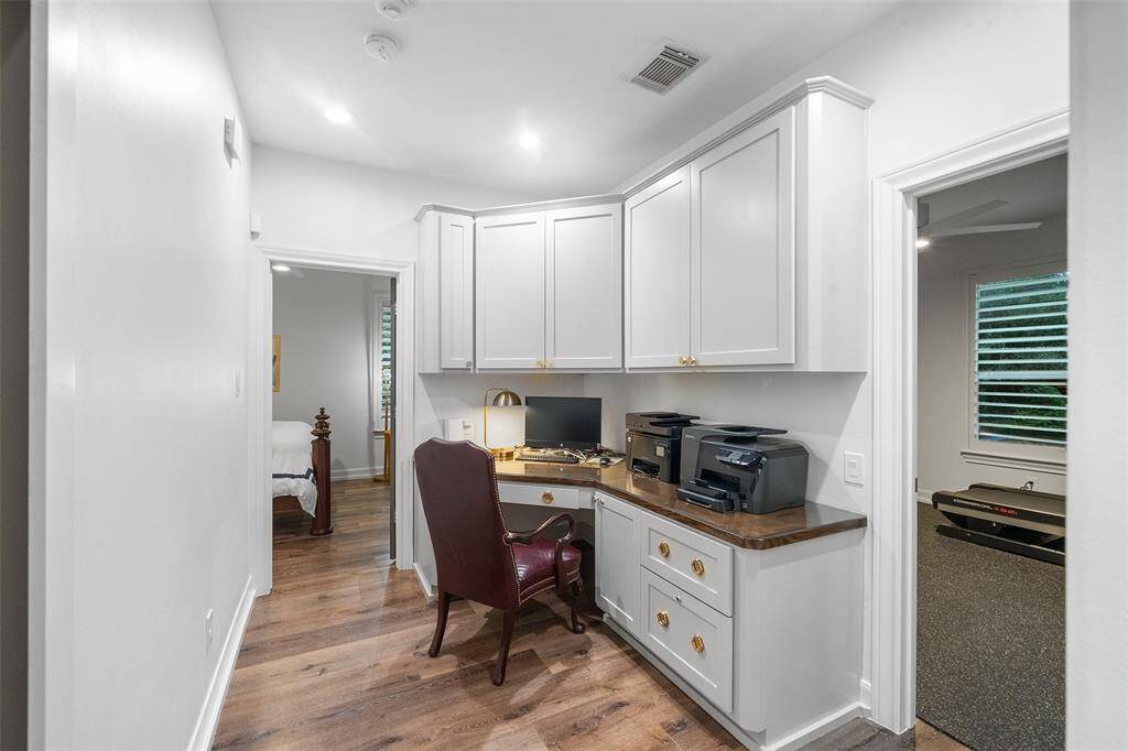Workspace that has painted cabinets and doors added along with new hardware. Great for kids or hobby area.
