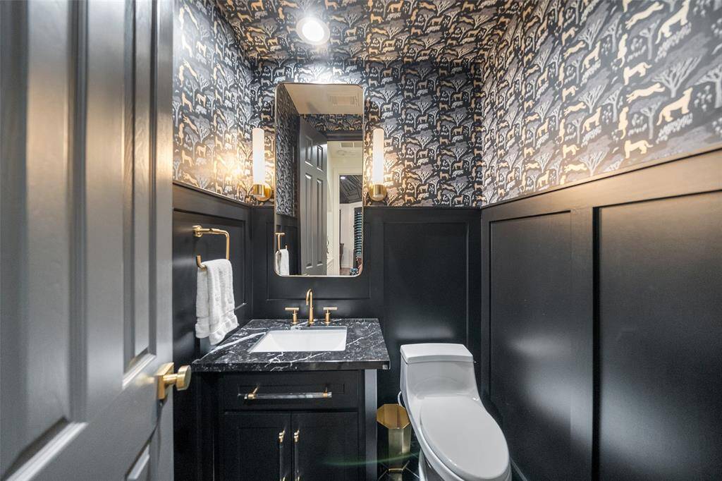Guest bathroom with new toilet, new hardware and lighting along with marble counters. BEAUTIFUL!