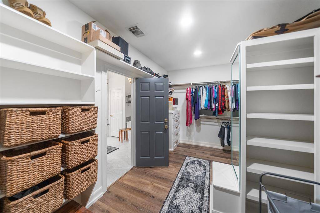 Primary closet has been re-worked to include drawers, shelving and room for 2 additional safes. GREAT use of space!
