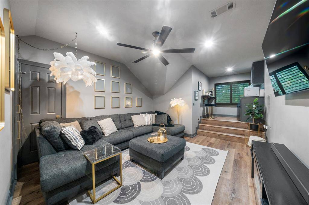 The media room is located upstairs and could be used as a 5th bedroom or game room. There is an elevated area that leads to the mini kitchen with beverage fridge.