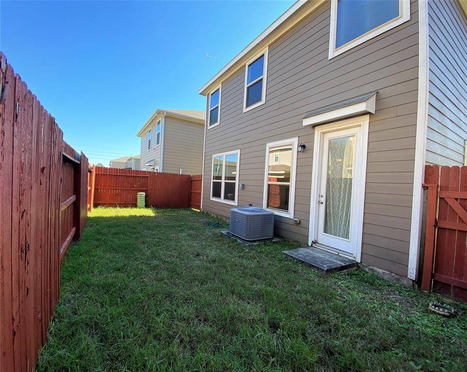 Cozy fenced backyard perfect for relaxation and privacy. Ideal for gardening or small gatherings.