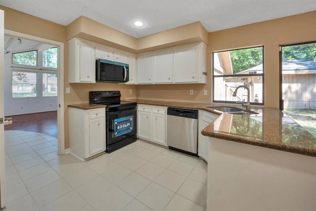 Kitchen open to bonus room