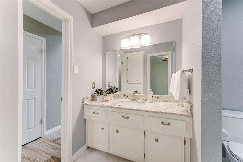 Experience a touch of modern elegance with this updated bathroom vanity.