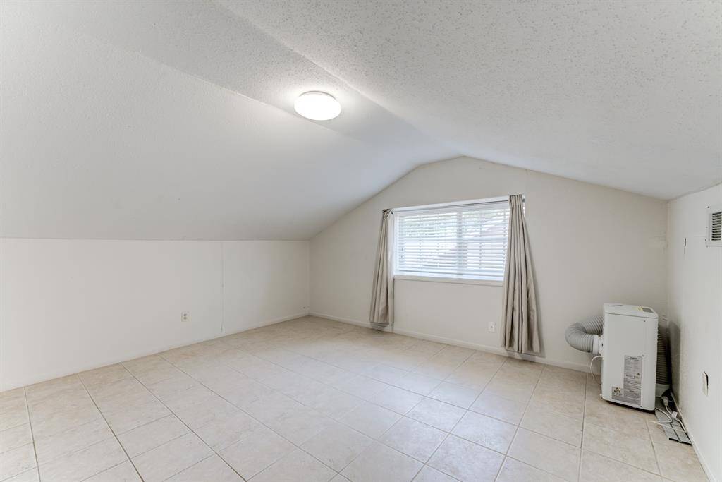 Take advantage of the extra space in this upstairs bonus room, enhanced by vaulted ceilings.