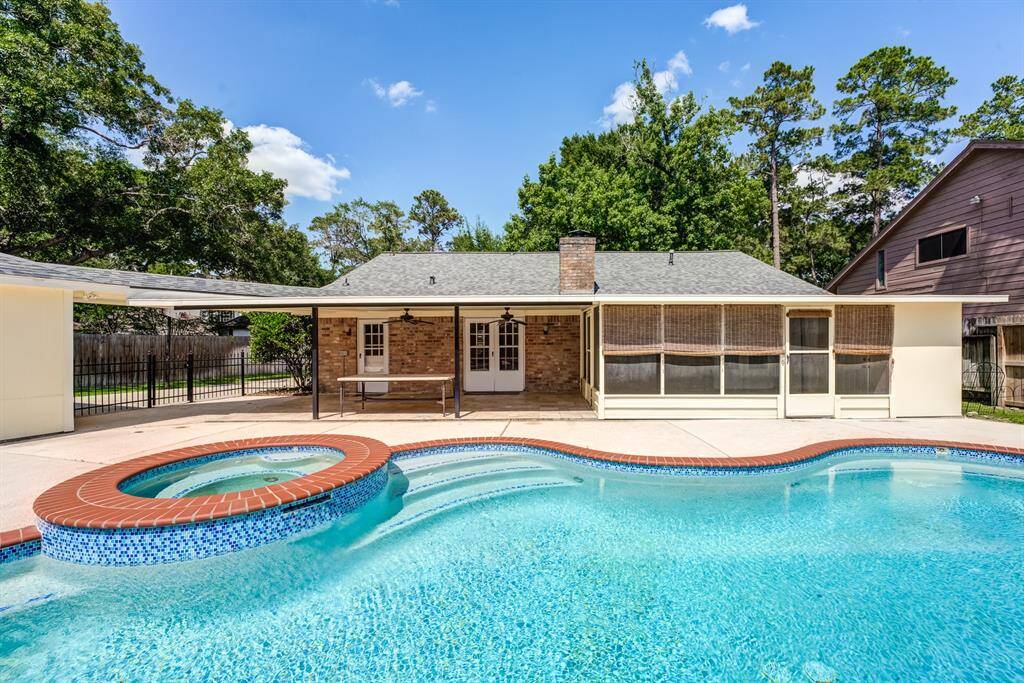 Picture yourself unwinding by this sparkling in-ground pool on a hot Texas day. This rental also includes a landlord-maintained pool, a screened-in porch with a fan to keep you cool, and a detached garage for extra storage.