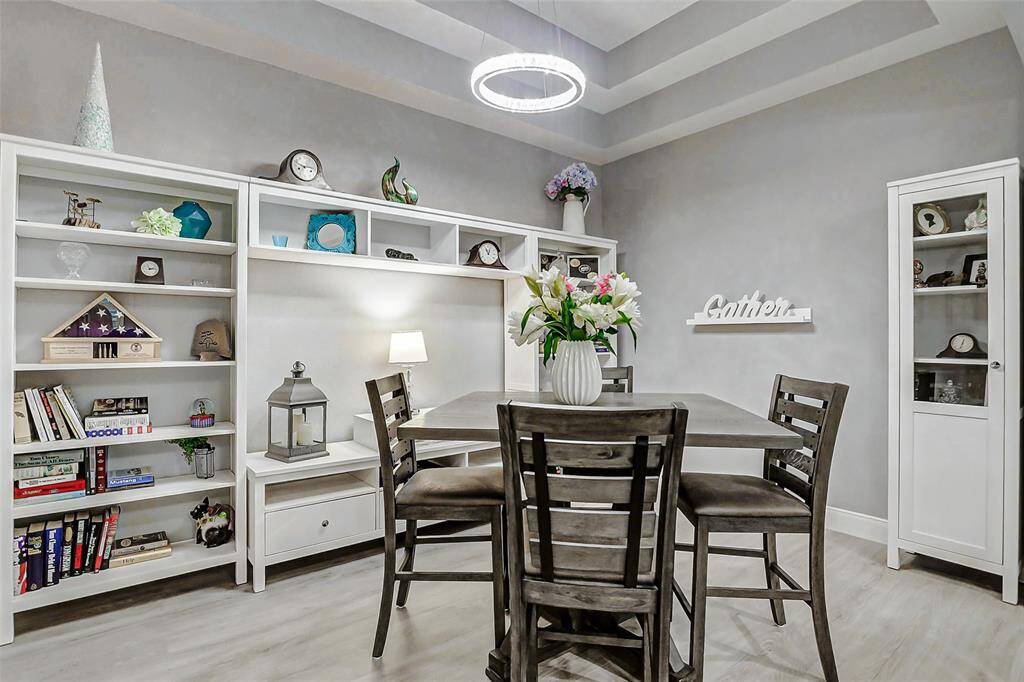 The generously sized dining area easily accommodates family gatherings and holiday feasts.