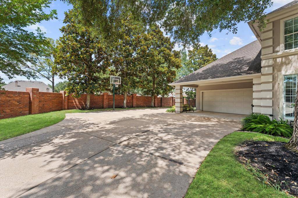 Check out this driveway which is the perfect basketball court! More parking is available to the side of the carport.