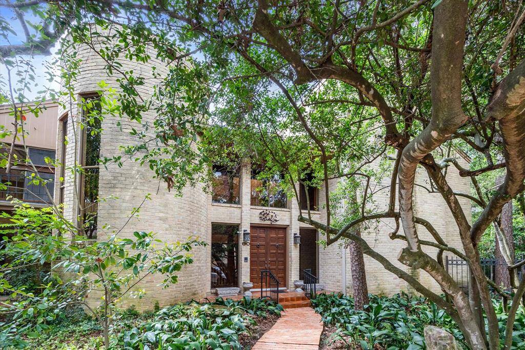 Spacious and ideally situated on a corner lot in gated Woodstone III.