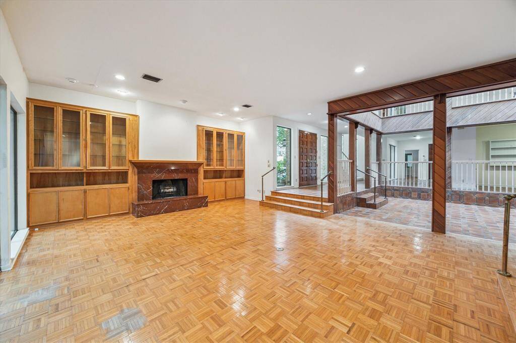 Built ins and a wood burning fireplace ground the living area.