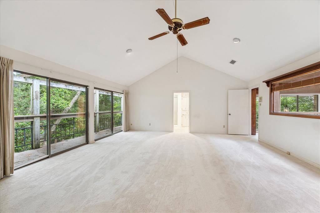 Lay in bed while viewing the treetops in this spacious primary bedroom with 2 primary baths and 2 walk in closets!