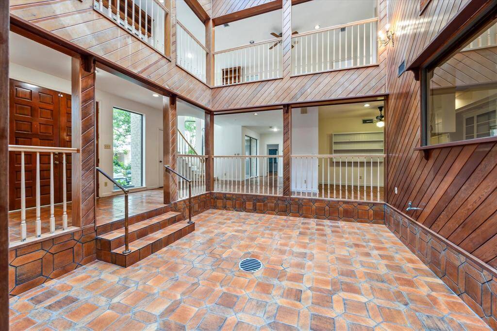 This atrium could be brought to even height with the entrance if preferred or serve as a dining room for hosting dinner under the stars.
