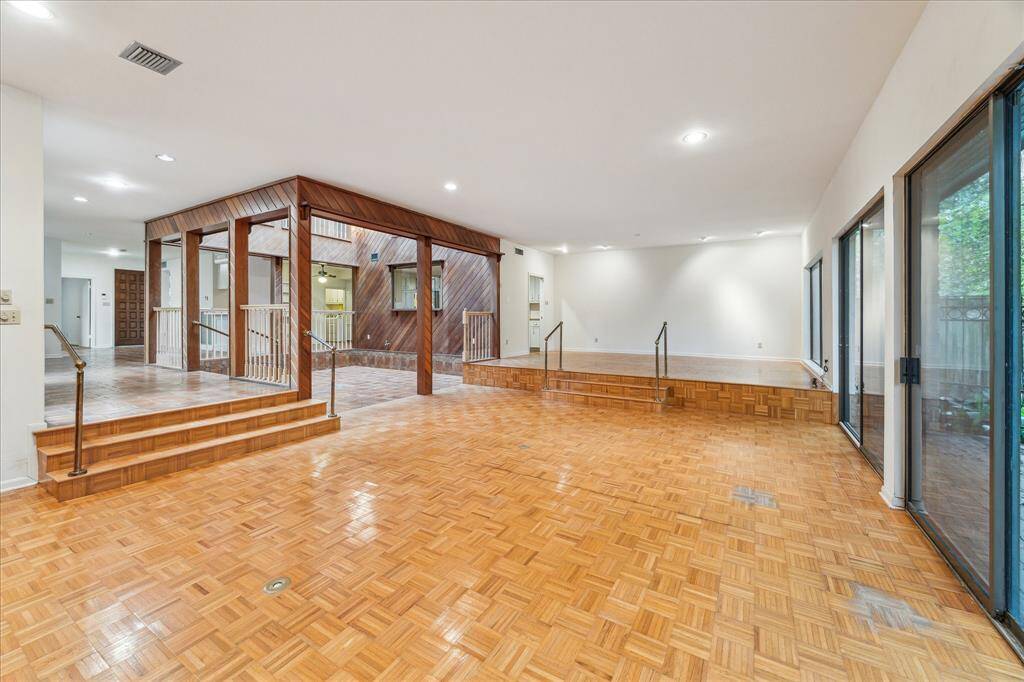 Another view of the living and raised dining area.