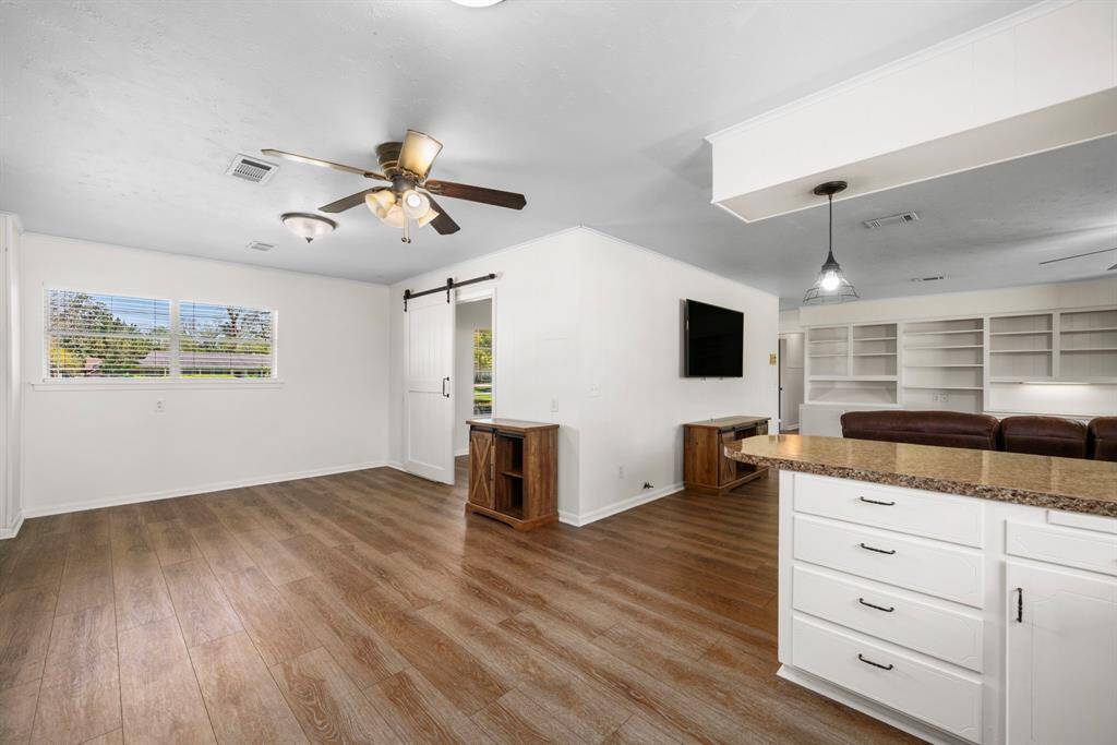 The breakfast/dining area will accommodate the largest of dining tables. Fabulous open floor plan will make entertaining a breeze. Barn door opens to the study/home office.