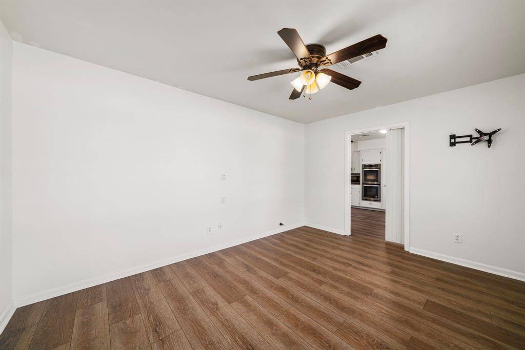 Another view of the large study. New neutral paint and gorgeous wood look LVP flooring. No carpet!