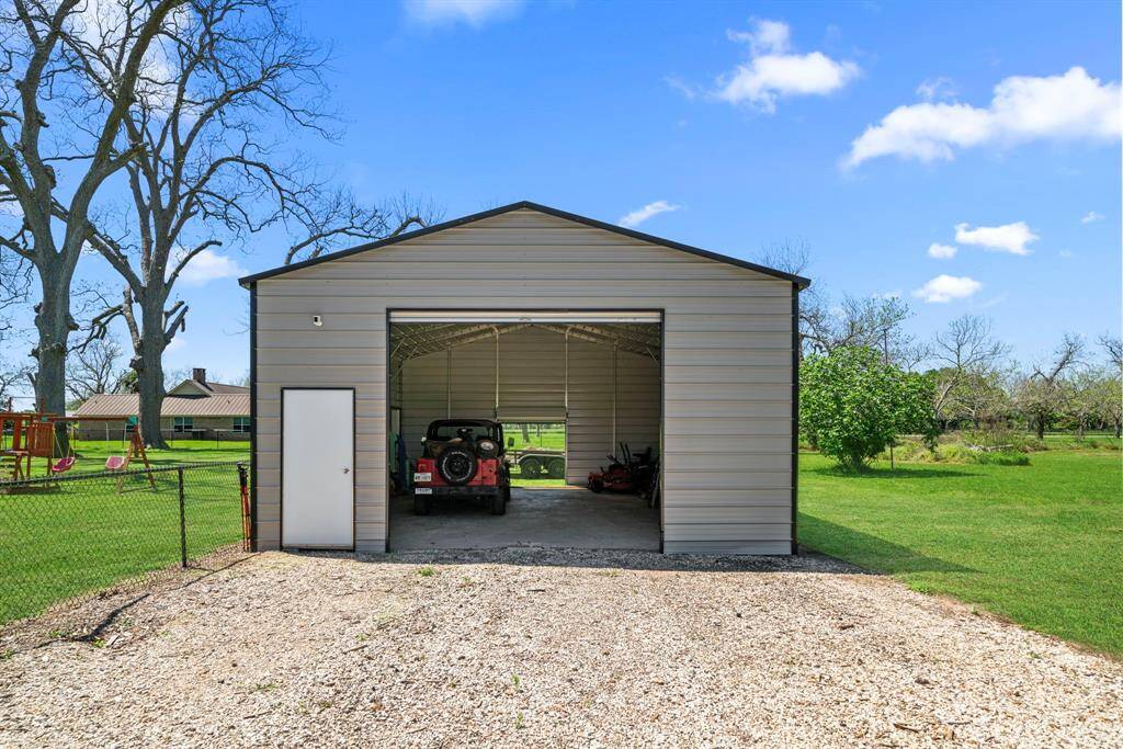 The 30 x 24 shop built in 2024 features rollup doors and multiple service doors.
