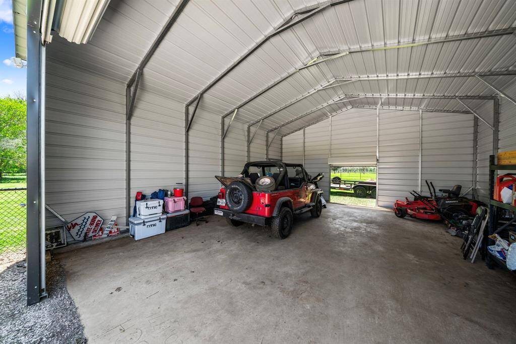 The large shop provides additional parking and can be used to store your boat, lawn equipment and more.