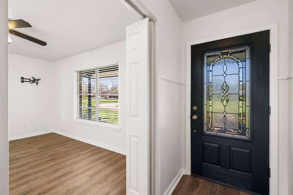Spacious welcoming entry to greet your guests. Note the New neutral paint and LVP flooring featured throughout this stunning home. No carpet!