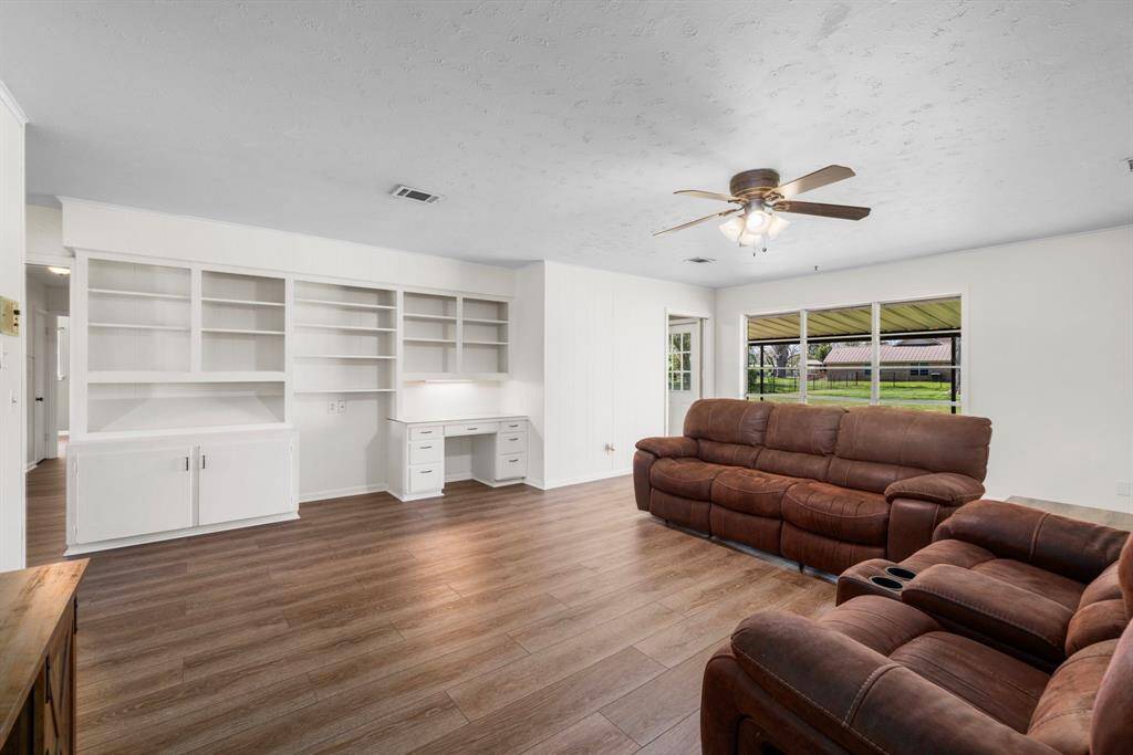 A closer view of the custom built in cabinetry. You will enjoy entertaining guests and spending quality family time in this great space. Ample room for multiple seating spaces.