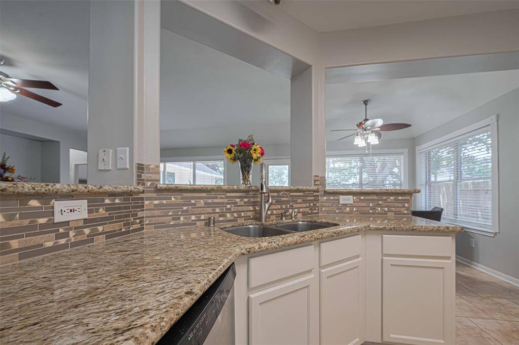 Additional view of the kitchen and breakfast bar