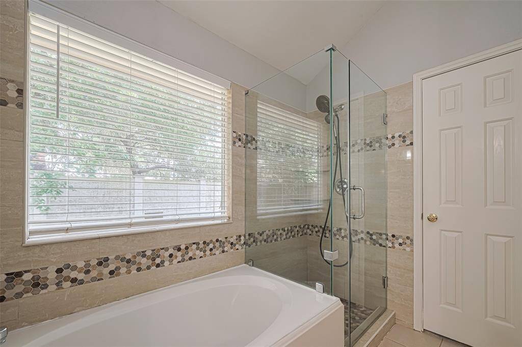 Additional view of the walk-in shower and tub