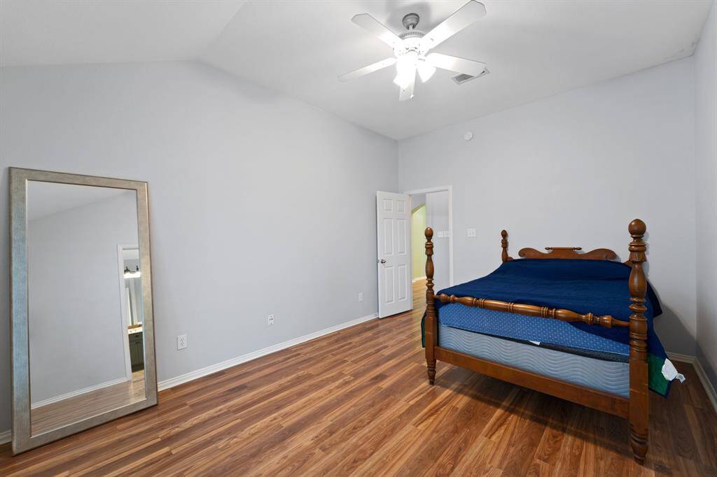 Spacious Primary bedroom with vaulted ceilings.