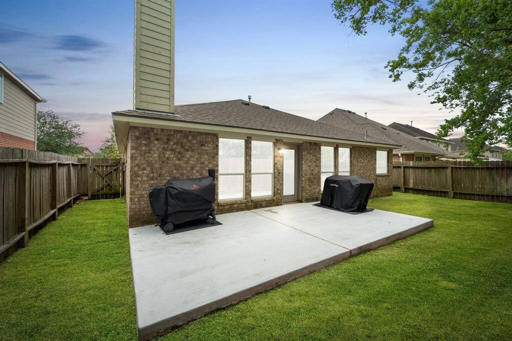 Backyard with extended patio.