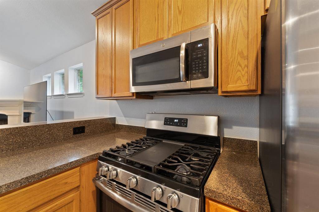 Gas stove top and microwave.