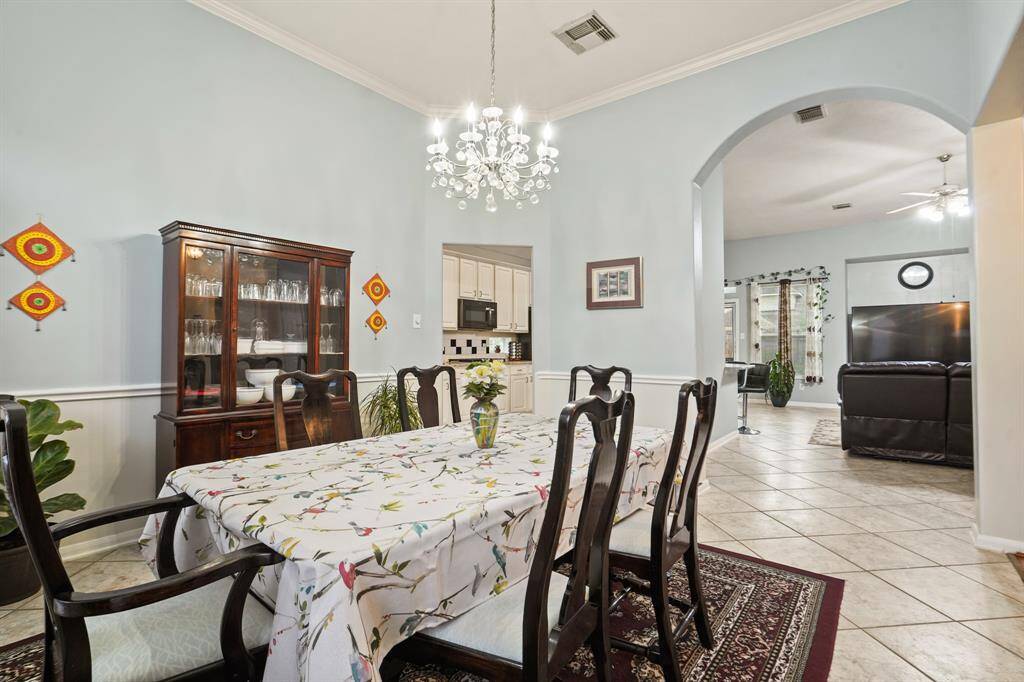 Formal Dining with Kitchen to the left and Living Room straight ahead