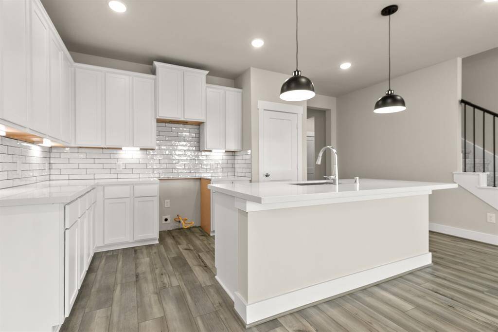 The open layout invites laughter and warmth, making it the perfect backdrop for family gatherings or cozy brunches with friends.